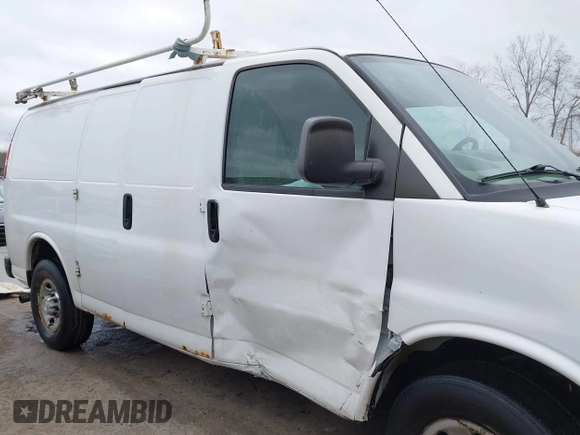 2015 Chevrolet Express Cargo Van with VIN 1GCWGFCFXF1259591, listed as a IAAI auction lot 42029679 with 144,023 mi miles. Bid and sale history available at carsss.com. Image 13.