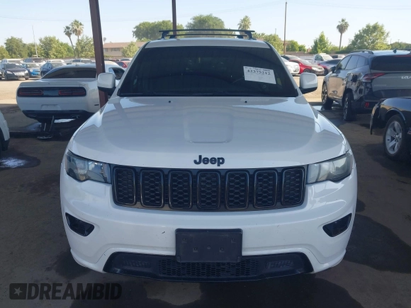 2018 Jeep Grand Cherokee Laredo E with VIN 1C4RJFAG5JC303228, listed as a IAAI auction lot 42375212 with 98,155 mi miles and . Bid and sale history available at DreamBid. Image 12.
