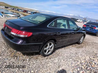 2006 Hyundai Azera SE with VIN KMHFC46F36A057974, listed as a Copart auction lot 52179905 with 142,391 mi miles and Salvage Title. Bid and sale history available at DreamBid. Image 3.