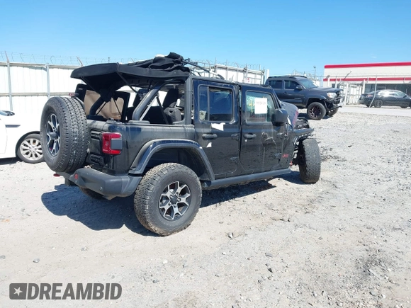 2020 Jeep Wrangler Unlimited Rubicon with VIN 1C4HJXFG2LW147242, listed as a IAAI auction lot 41630952 with Not provided miles and . Bid and sale history available at DreamBid. Image 4.