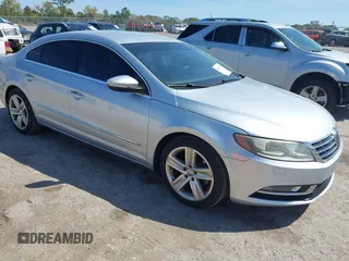 2013 Volkswagen CC Sport with VIN WVWBN7AN7DE556635, listed as a IAAI auction lot 41808795 with 88,482 mi miles and . Bid and sale history available at DreamBid. Image 1.