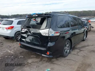 2011 Toyota Sienna SE with VIN 5TDXK3DCXBS112867, listed as a IAAI auction lot 41394925 with 235,567 mi miles. Bid and sale history available at carsss.com. Image 4.