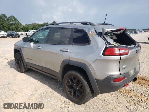 2016 Jeep Cherokee Trailhawk z VIN 1C4PJMBSXGW121272, wystawiony jako Copart lot #61769505 z przebiegiem 119 353 mil mil oraz Szkoda całkowita • Salvage title. Historia ofert i sprzedaży dostępna na DreamBid. Obrazek 2.