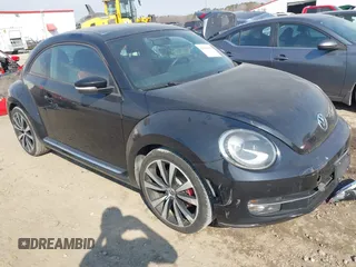 2012 Volkswagen Beetle 2.0T Turbo with VIN 3VWV67ATXCM648515, listed as a IAAI auction lot 41666994 with 142,085 mi miles. Bid and sale history available at carsss.com. Image 1.
