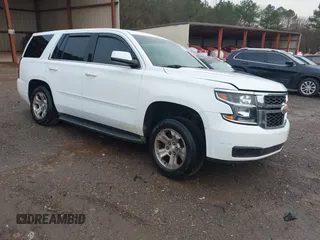 2015 Chevrolet Tahoe Commercial z VIN 1GNLC2KC9FR545486, wystawiony jako IAAI lot #41591764 z przebiegiem Nie podano mil oraz . Historia ofert i sprzedaży dostępna na DreamBid. Obrazek 1.
