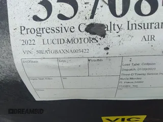 2022 Lucid Air Grand Touring z VIN 50EA1GBAXNA003422, wystawiony jako IAAI lot #35708415 z przebiegiem Nie podano mil oraz . Historia ofert i sprzedaży dostępna na DreamBid. Obrazek 9.