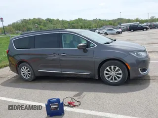 2017 Chrysler Pacifica Touring L with VIN 2C4RC1BG1HR540246, listed as a IAAI auction lot 42107768 with 151,268 mi miles and . Bid and sale history available at DreamBid. Image 13.