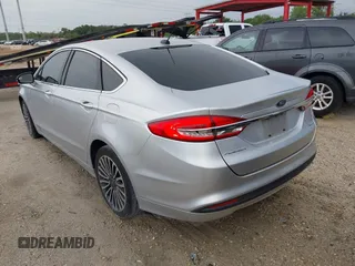 2017 Ford Fusion SE z VIN 3FA6P0HD5HR166433, wystawiony jako IAAI lot #42394998 z przebiegiem 121 333 mil mil oraz . Historia ofert i sprzedaży dostępna na DreamBid. Obrazek 3.