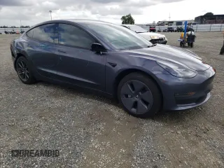2023 Tesla Model 3 with VIN 5YJ3E1EA7PF395196, listed as a Copart auction lot 51260465 with 41,119 mi miles and Salvage title. Bid and sale history available at DreamBid. Image 4.