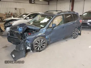 2018 Subaru Forester Premium with VIN JF2SJGECXJH606668, listed as a IAAI auction lot 41879710 with 64,910 mi miles. Bid and sale history available at carsss.com. Image 2.