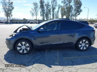 2022 Tesla Model Y Long Range with VIN 7SAYGAEEXNF381389, listed as a IAAI auction lot 41613075 with 52,800 mi miles and . Bid and sale history available at carsss.com. Image 14.