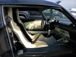 2005 Lotus Elise z VIN SCCPC11185HL33735, wystawiony jako Copart lot #45533345 z przebiegiem 88 155 mil mil oraz Szkody całkowita. Historia ofert i sprzedaży dostępna na DreamBid. Obrazek 10.