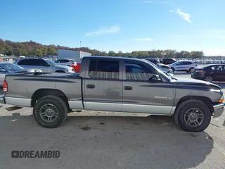 2001 Dodge Dakota Sport with VIN 1B7HL2AN21S319390, listed as a IAAI auction lot 40836729 with 118,823 mi miles. Bid and sale history available at carsss.com. Image 13.