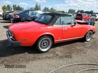 1979 FIAT 124 Spider z VIN 124CS20142625, wystawiony jako Copart lot #63245354 z przebiegiem 41 509 mil mil oraz Tytuł czysty. Historia ofert i sprzedaży dostępna na DreamBid. Obrazek 3.
