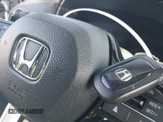 2024 Honda Civic Si z VIN 2HGFE1E54RH470452, wystawiony jako IAAI lot #41146132 z przebiegiem 18 620 mil mil oraz . Historia ofert i sprzedaży dostępna na DreamBid. Obrazek 11.