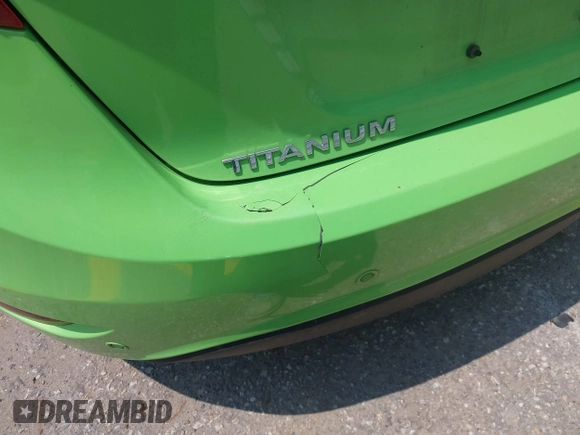 2014 Ford Fiesta Titanium z VIN 3FADP4FJ7EM203322, wystawiony jako IAAI lot #42448840 z przebiegiem 91 901 mil mil oraz . Historia ofert i sprzedaży dostępna na DreamBid. Obrazek 13.