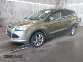 2013 Ford Escape SEL with VIN 1FMCU0HX0DUB83459, listed as a IAAI auction lot 41985453 with 198,182 mi miles and . Bid and sale history available at DreamBid. Image 2.
