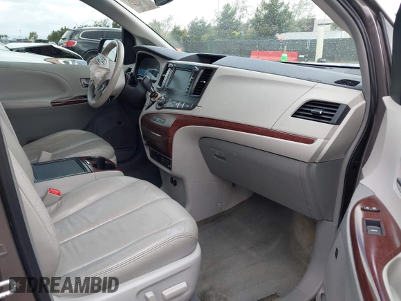 2014 Toyota Sienna XLE with VIN 5TDYK3DC7ES517206, listed as a IAAI auction lot 41945572 with 128,743 mi miles and . Bid and sale history available at DreamBid. Image 5.