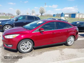 2015 Ford Focus Titanium with VIN 1FADP3J29FL230664, listed as a IAAI auction lot 41870083 with 125,578 mi miles and . Bid and sale history available at DreamBid. Image 14.