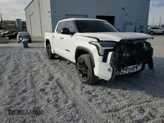 2022 Toyota Tundra Limited z VIN 5TFJA5DB2NX021229, wystawiony jako Copart lot #75503534 z przebiegiem Nie podano mil oraz Szkoda całkowita • Salvage title. Historia ofert i sprzedaży dostępna na DreamBid. Obrazek 11.