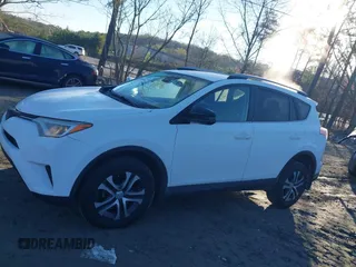 2017 Toyota RAV4 LE with VIN JTMZFREV5HJ701508, listed as a IAAI auction lot 41854606 with 175,000 mi miles and . Bid and sale history available at DreamBid. Image 14.