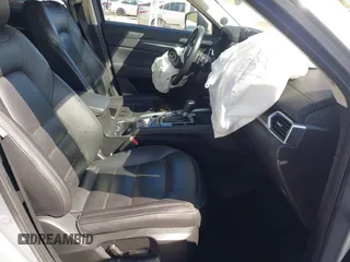 2021 Mazda CX-5 Grand Touring with VIN JM3KFBDM3M1300316, listed as a IAAI auction lot 41878520 with 77,670 mi miles and . Bid and sale history available at DreamBid. Image 5.