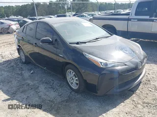 2021 Toyota Prius L Eco z VIN JTDKAMFU6M3141392, wystawiony jako IAAI lot #42317866 z przebiegiem 137 495 mil mil oraz . Historia ofert i sprzedaży dostępna na DreamBid. Obrazek 1.