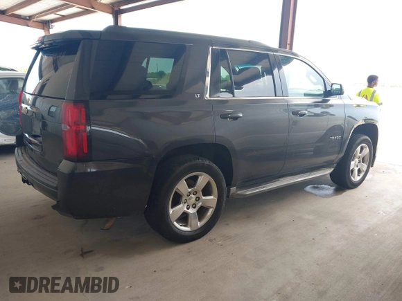 2015 Chevrolet Tahoe LT with VIN 1GNSCBKC5FR105437, listed as a IAAI auction lot 42052084 with 348,093 mi miles and . Bid and sale history available at DreamBid. Image 4.