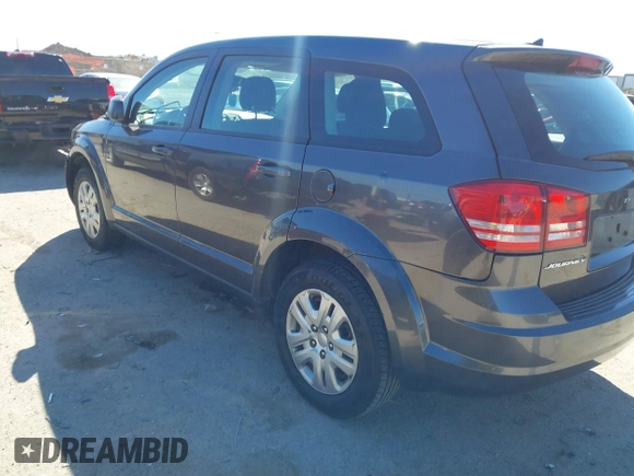 2015 Dodge Journey SE z VIN 3C4PDCAB5FT739266, wystawiony jako IAAI lot #41725086 z przebiegiem 134 109 mil mil oraz . Historia ofert i sprzedaży dostępna na DreamBid. Obrazek 3.