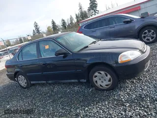 1997 Honda Civic EX with VIN 2HGEJ8542VH520783, listed as a IAAI auction lot 40744085 with 155,772 mi miles. Bid and sale history available at carsss.com. Image 13.