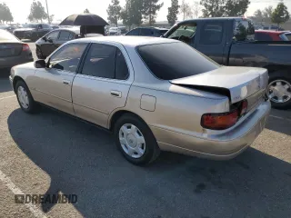 1995 Toyota Camry LE with VIN JT2GK12E7S0107467, listed as a Copart auction lot 83491534 with 112,971 mi miles and Salvage Title. Bid and sale history available at carsss.com. Image 2.