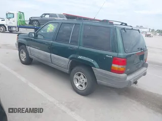 1998 Jeep Grand Cherokee Laredo with VIN 1J4GZ58S7WC284106, listed as a IAAI auction lot 42558498 with 316,354 mi miles and . Bid and sale history available at DreamBid. Image 3.