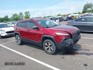 2014 Jeep Cherokee Trailhawk with VIN 1C4PJMBS7EW162357, listed as a IAAI auction lot 42601903 with 104,768 mi miles and . Bid and sale history available at DreamBid. Image 1.