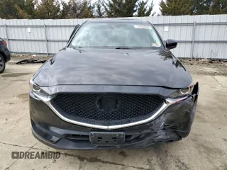 2017 Mazda CX-5 Touring with VIN JM3KFACLXH0195725, listed as a Copart auction lot 47464365 with 65,457 mi miles and Salvage Title. Bid and sale history available at carsss.com. Image 5.