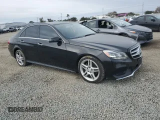 2014 Mercedes-Benz E 350 Sport with VIN WDDHF5KB7EA892557, listed as a Copart auction lot 46121175 with 122,789 mi miles and Salvage Title. Bid and sale history available at DreamBid. Image 4.