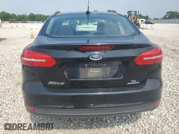 2016 Ford Focus SE with VIN 1FADP3F22GL233402, listed as a Copart auction lot 60854175 with 77,002 mi miles and Salvage title. Bid and sale history available at DreamBid. Image 6.