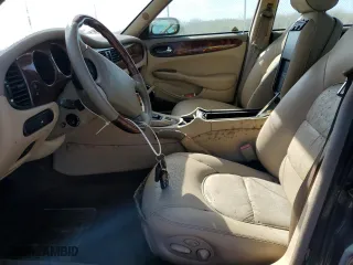 1999 Jaguar XJ with VIN SAJKX6047XC861227, listed as a Copart auction lot 75007414 with 0 mi miles and Salvage Title. Bid and sale history available at carsss.com. Image 7.