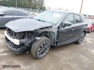2016 Mazda CX-5 Grand Touring with VIN JM3KE4DY0G0652829, listed as a IAAI auction lot 41786042 with NaN miles. Bid and sale history available at carsss.com. Image 2.