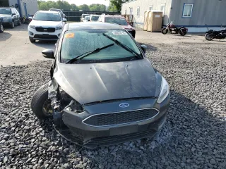 2016 Ford Focus SE z VIN 1FADP3F24GL313333, wystawiony jako Copart lot #60023715 z przebiegiem Nie podano mil oraz Szkoda całkowita • Salvage title. Historia ofert i sprzedaży dostępna na DreamBid. Obrazek 5.