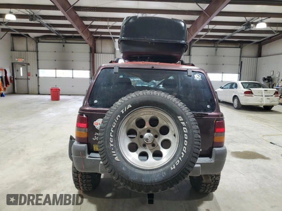 1996 Jeep Grand Cherokee Laredo with VIN 1J4GZ58Y1TC171915, listed as a Copart auction lot 50764034 with 0 mi miles and Salvage Title. Bid and sale history available at carsss.com. Image 6.