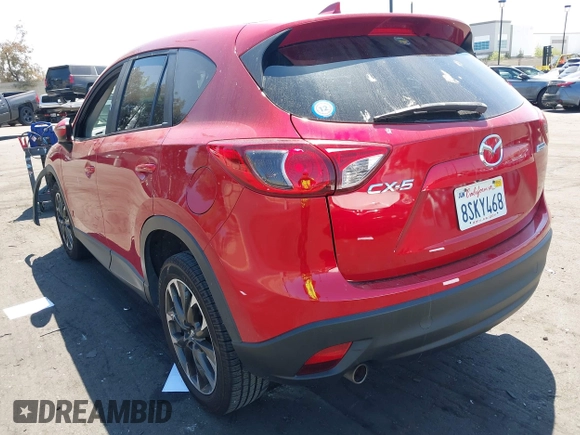 2016 Mazda CX-5 Grand Touring z VIN JM3KE2DY2G0660385, wystawiony jako IAAI lot #42101004 z przebiegiem 166 336 mil mil oraz . Historia ofert i sprzedaży dostępna na DreamBid. Obrazek 3.