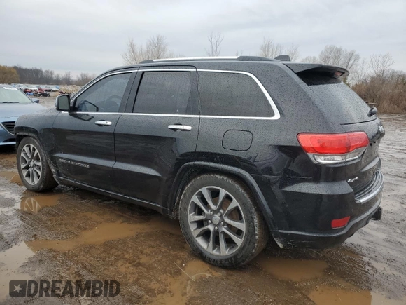 2017 Jeep Grand Cherokee Overland with VIN 1C4RJFCG0HC836448, listed as a Copart auction lot 47053705 with 87,459 mi miles and Salvage Title. Bid and sale history available at carsss.com. Image 2.