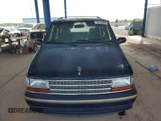 1993 Plymouth Voyager z VIN 2P4GH25K1PR283274, wystawiony jako Copart lot #79144394 z przebiegiem 105 890 mil mil oraz Tytuł czysty. Historia ofert i sprzedaży dostępna na DreamBid. Obrazek 5.