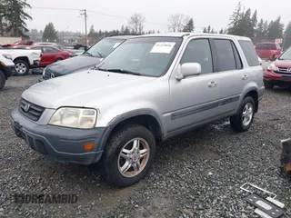 1999 Honda CR-V EX with VIN JHLRD1866XC033865, listed as a IAAI auction lot 41219896 with 142,396 mi miles. Bid and sale history available at carsss.com. Image 2.