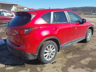 2016 Mazda CX-5 Touring with VIN JM3KE4CY4G0860035, listed as a IAAI auction lot 41678299 with 72,101 mi miles. Bid and sale history available at carsss.com. Image 4.