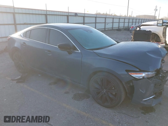 2021 Mazda 6 Carbon Edition with VIN JM1GL1WY9M1619981, listed as a IAAI auction lot 41751194 with 32,083 mi miles and . Bid and sale history available at DreamBid. Image 1.