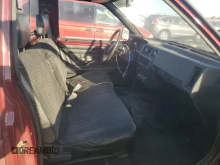 1989 Nissan Hardbody z VIN 1N6ND11S7KC371977, wystawiony jako Copart lot #77245404 z przebiegiem 202 526 mil mil oraz Tytuł czysty. Historia ofert i sprzedaży dostępna na DreamBid. Obrazek 10.