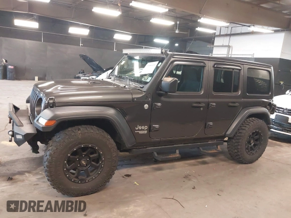 2018 Jeep Wrangler Unlimited Sport S с VIN 1C4HJXDG7JW280918, выставлен на аукционе IAAI как лот 41998831 с пробегом 66 539 миль миль и . История ставок и продаж доступна на DreamBid. Изображение 14.