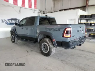 2021 Ram 1500 with VIN 0K1905786880, listed as a Copart auction lot 61756114 with 34,927 mi miles and Clean title. Bid and sale history available at DreamBid. Image 2.
