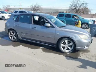 2005 Mazda 3 s with VIN JM1BK343751275651, listed as a IAAI auction lot 41612661 with 242,041 mi miles. Bid and sale history available at carsss.com. Image 1.
